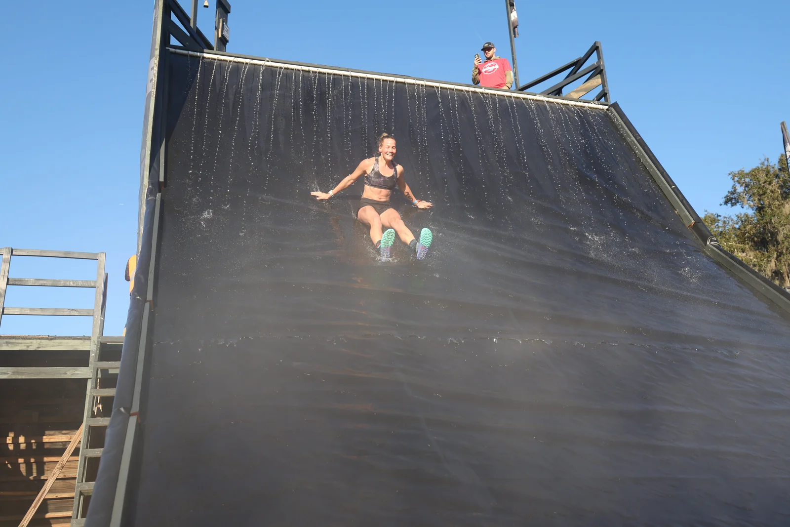 A racer descends the giant waterslide
