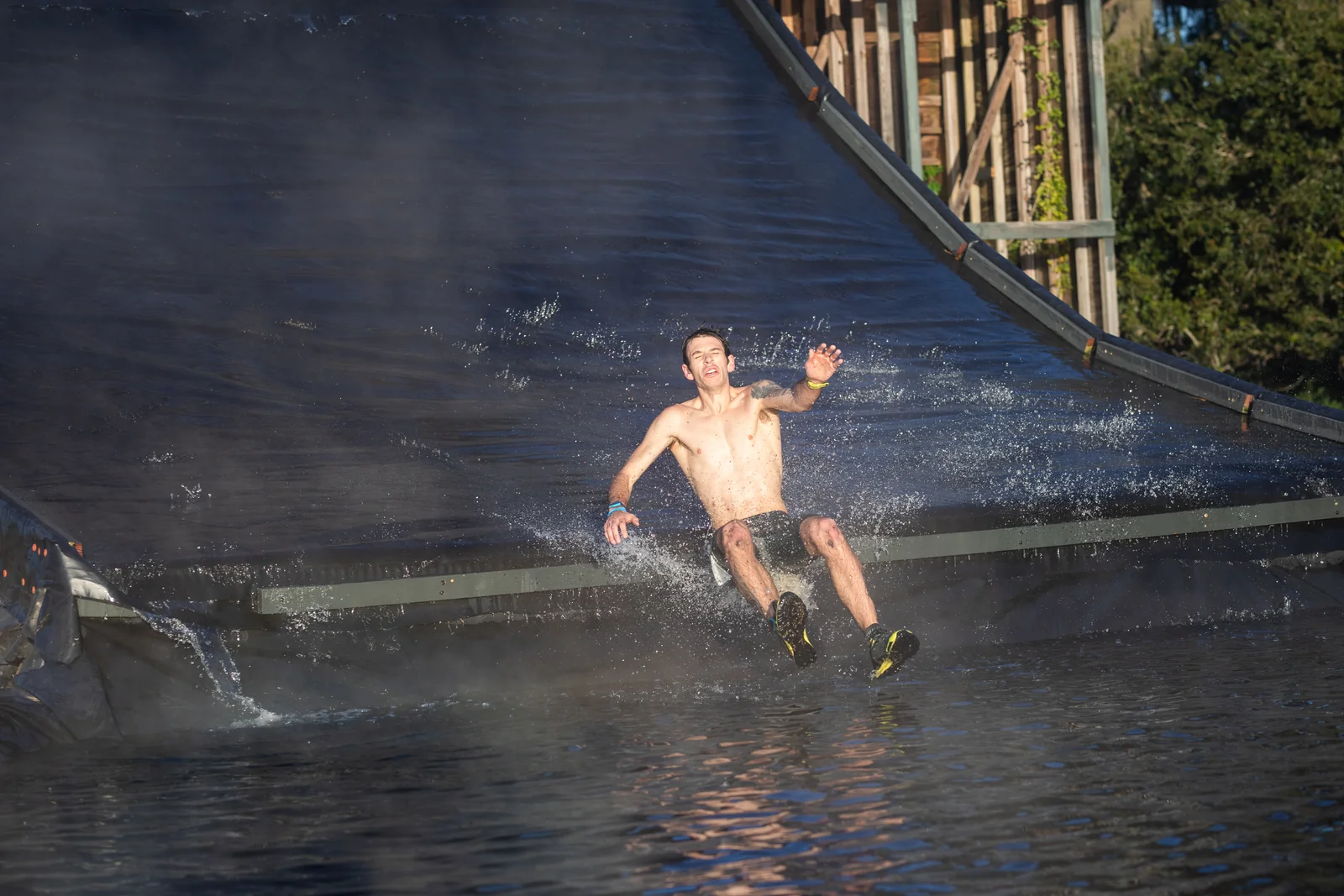 A racer splashes down the giant waterslide